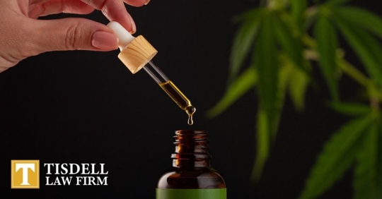 person holding THC oil