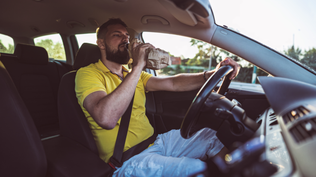 Drunk Driving in Action. Realistic Scene Behind the Wheel